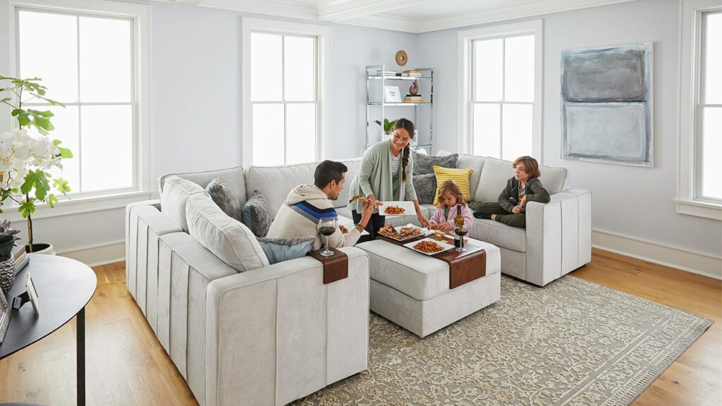 A family enjoys dinner in a living room